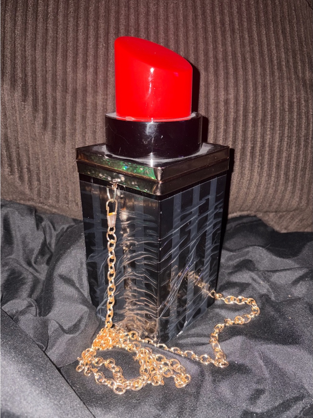 Acrylic red lipstick-shaped purse with gold chain. Brand new.